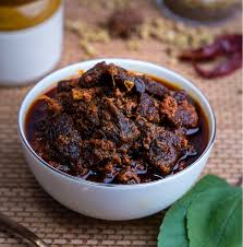 “Andhra style Natu Kodi pickle recipe with country chicken and spices