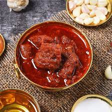 “Traditional Andhra mutton with bone pickle made with spicy red chilies and aromatic spices”